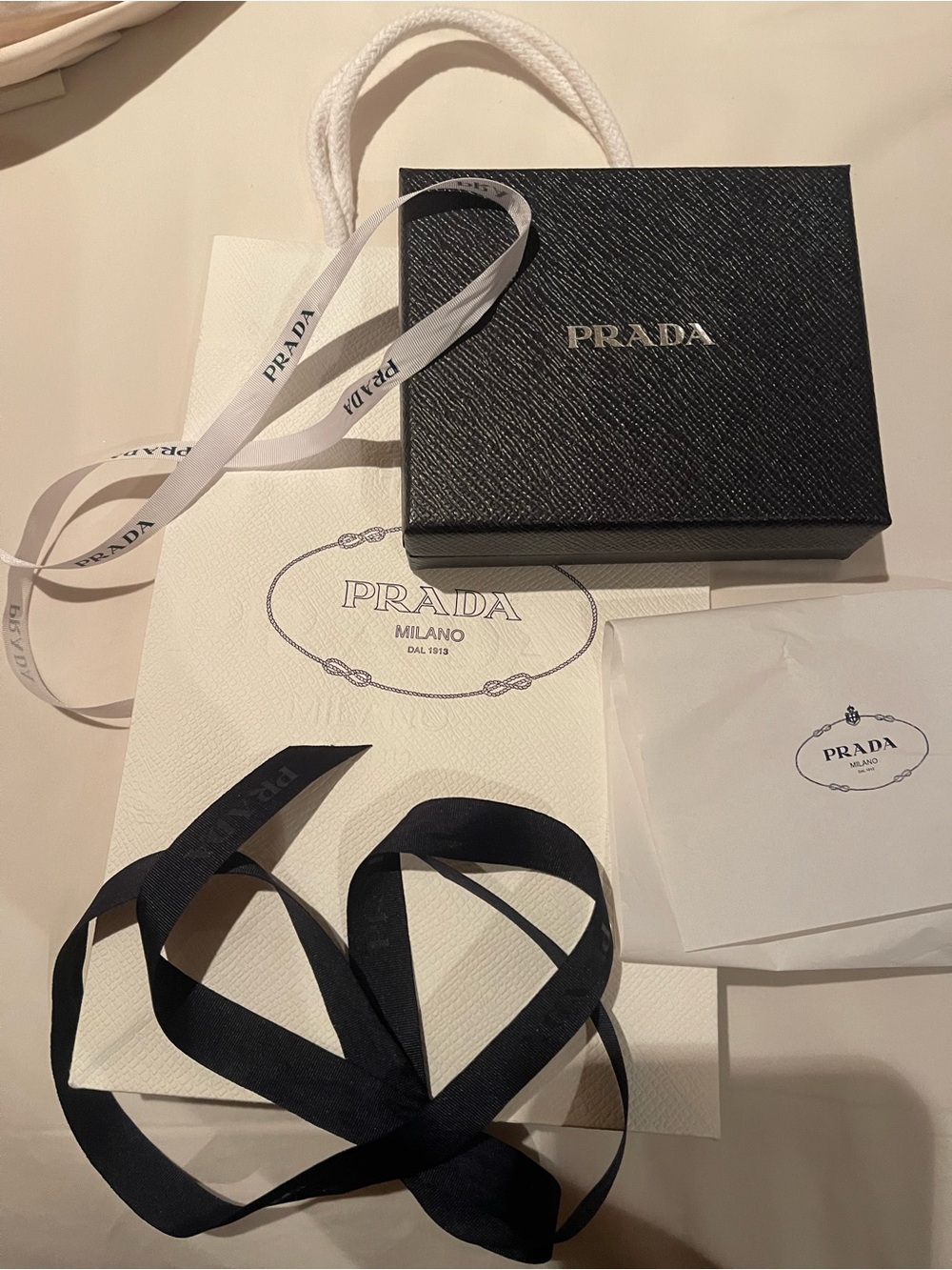Prada Black Saffiano Box with White Ribbon and bag.  Perfect for wallet
